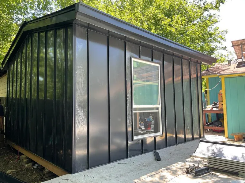 Black standing seam metal wall panels for Metal Roof Installation in Arab